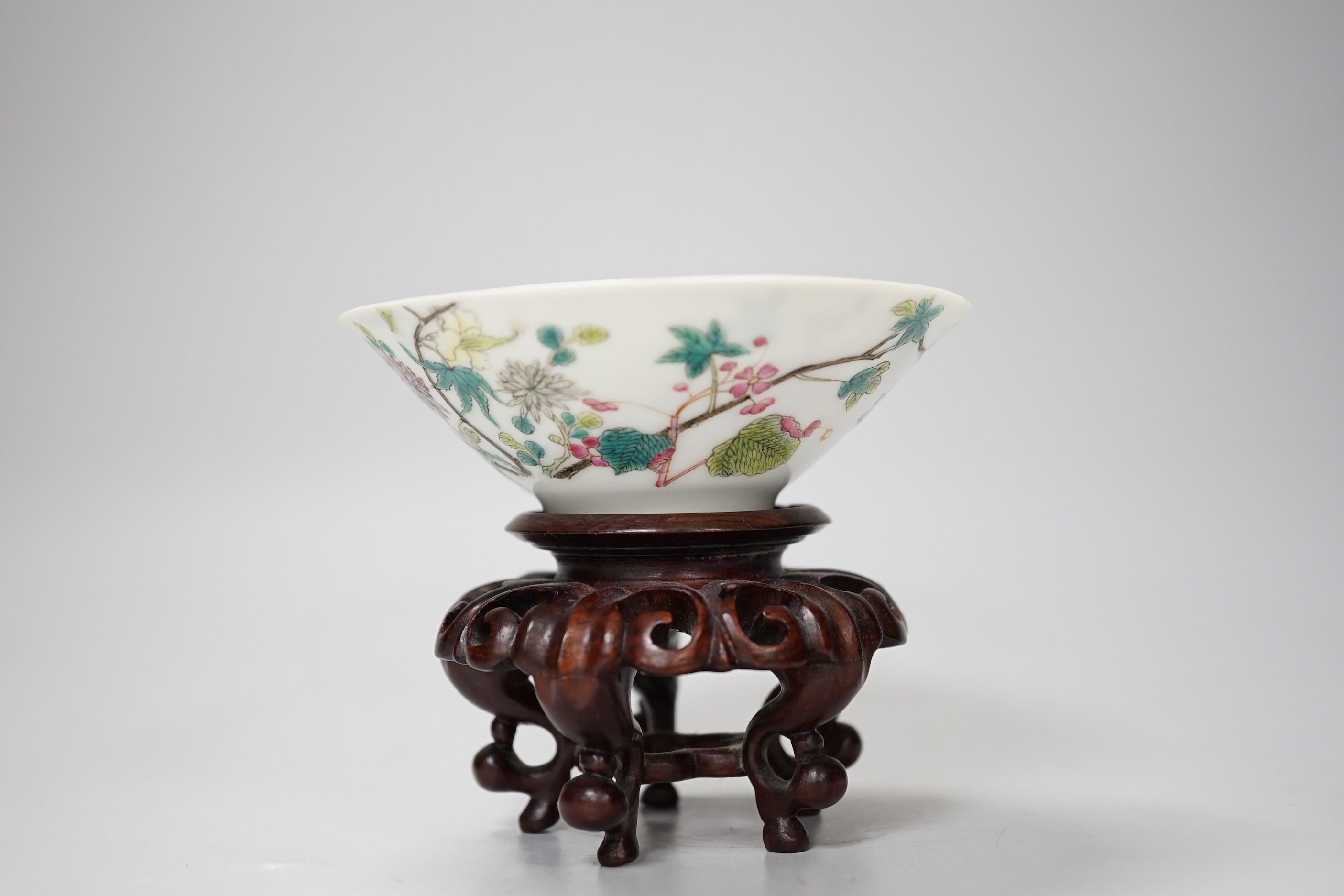 A Chinese famille rose conical bowl, Xuande mark but Republic period, wood stand 10cm diameter